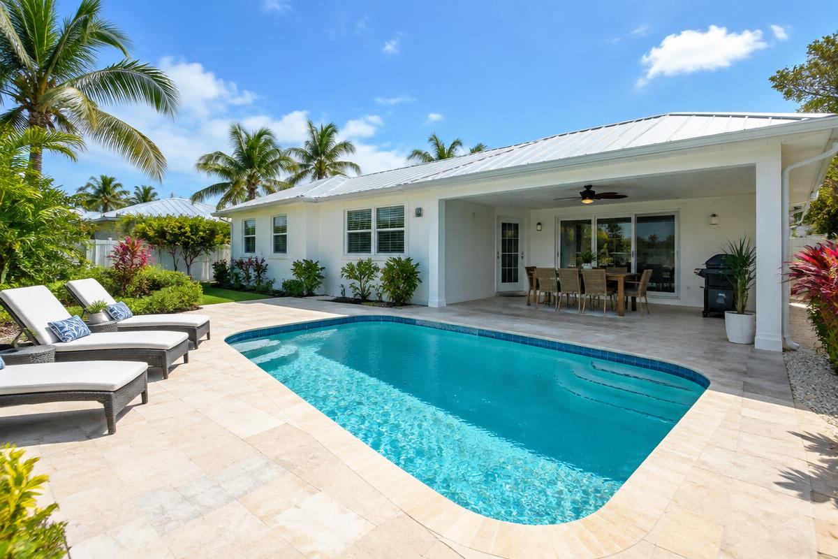 Illustrative Florida vacation home with a swimming pool and covered patio